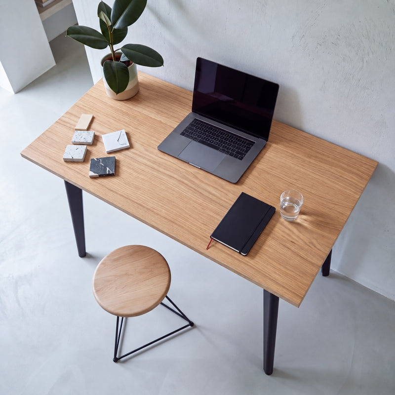 Oak desk with black tapered oak legs, seen from above