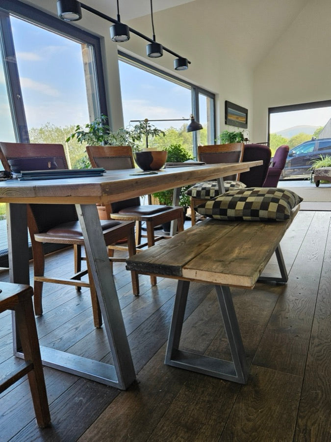 Reclaimed timber dining table and bench on clear coat trapezium box section legs